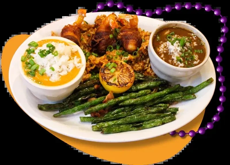 Cajun meal: jambalaya, bacon-wrapped shrimp, green beans, and two soups.