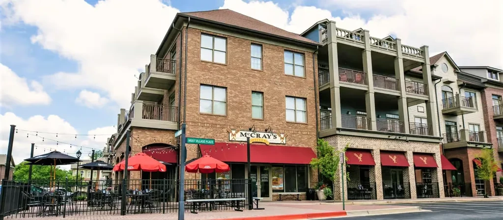 McCray's Tavern: multi-story brick building with outdoor patio.