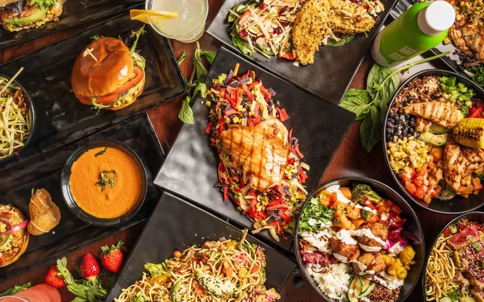 Overhead view: colorful spread of varied dishes and drinks.