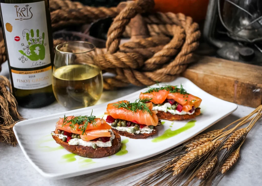 Smoked salmon appetizers with beets and dill, Kris Pinot Grigio wine.