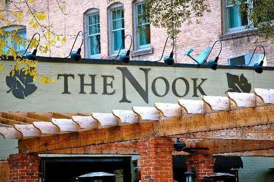 The Nook building exterior, showing leaf logo sign and pergola.