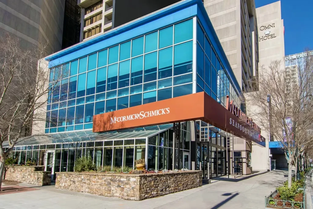Modern McCormick & Schmick's Seafood Restaurant exterior with glass and stone.
