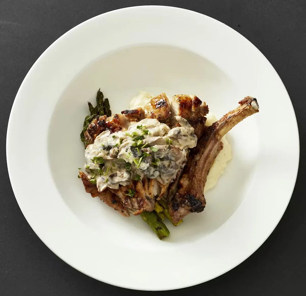 Seared bone-in chop, mushroom sauce, potato puree, asparagus.