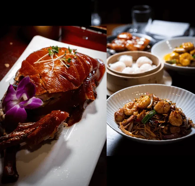 Sliced roasted duck, shrimp noodles, and steamed dumplings on a table.