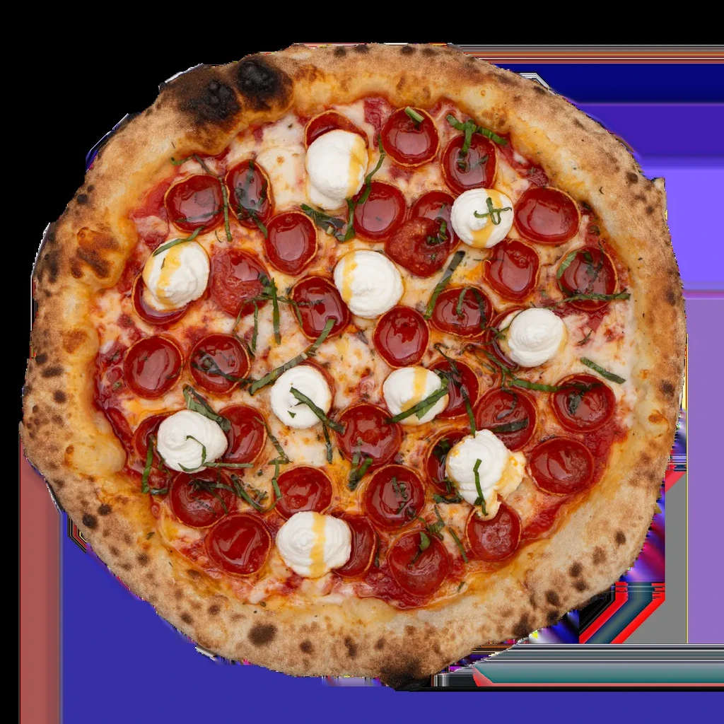 Top-down, close-up of a Neapolitan pizza with pepperoni, mozzarella, and basil.