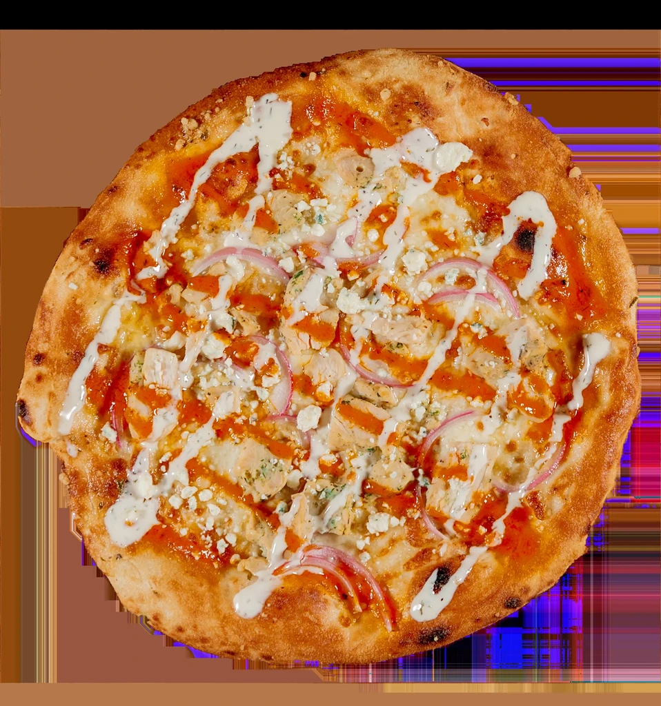 Overhead view of freshly baked buffalo chicken pizza with two sauces.