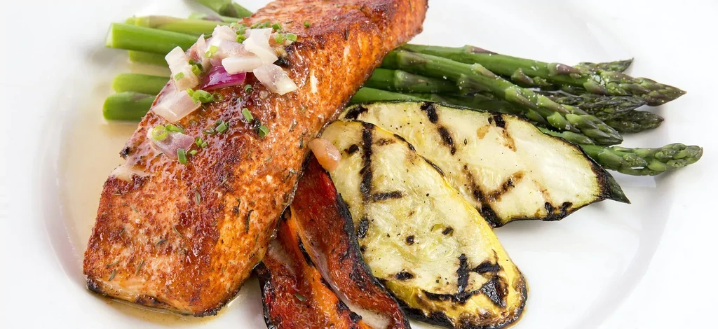 Grilled salmon, red onion relish, asparagus, and char-marked squash.