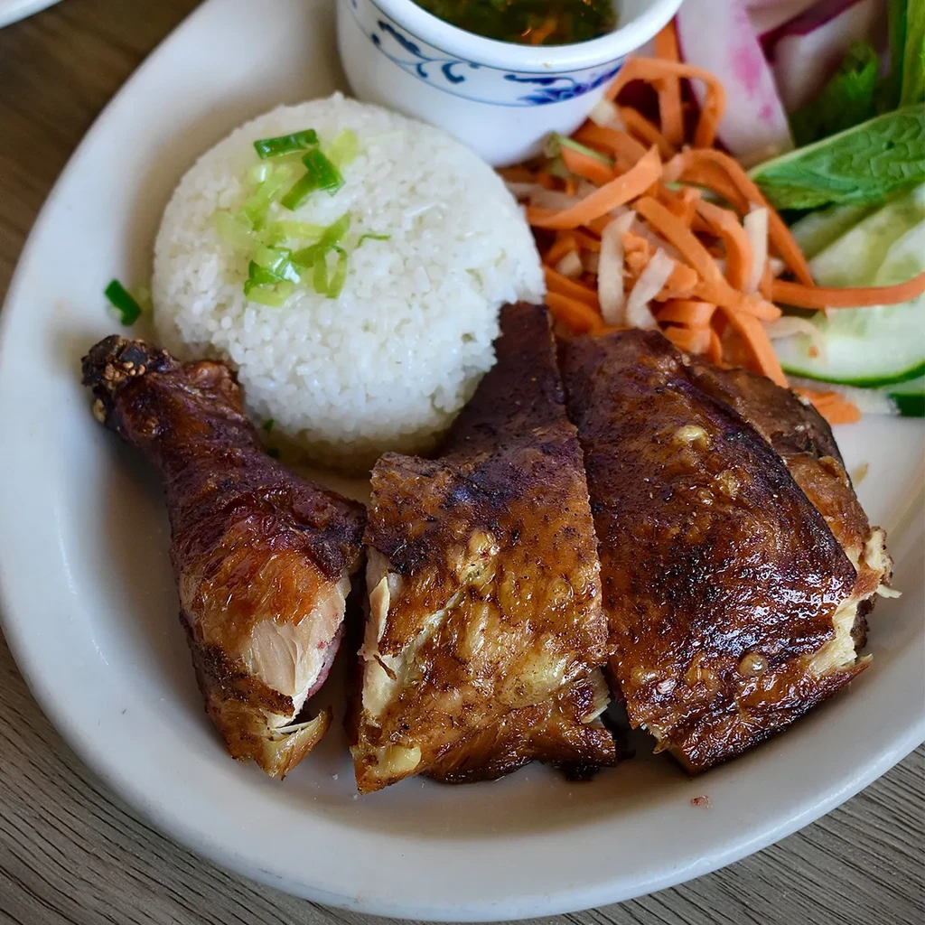 Grilled chicken, rice, green dipping sauce, and pickled vegetable salad.
