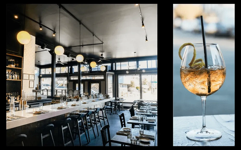 Modern restaurant interior and a close-up amber cocktail with lemon peel.