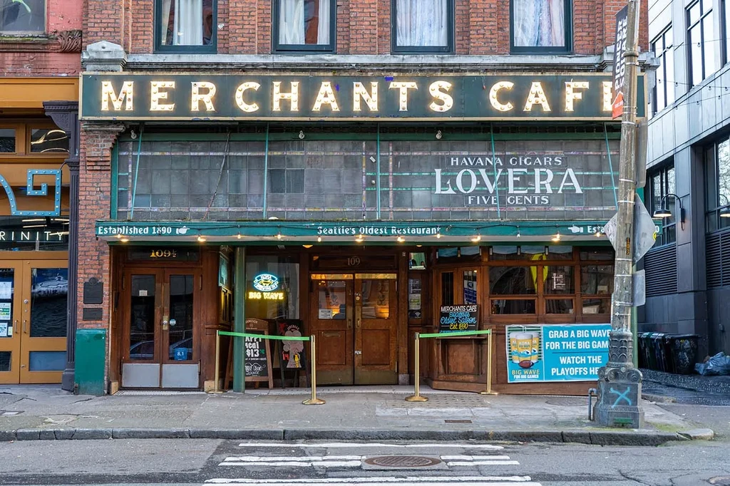 Old brick Merchants Cafe exterior, Seattle's oldest restaurant, vintage signs.