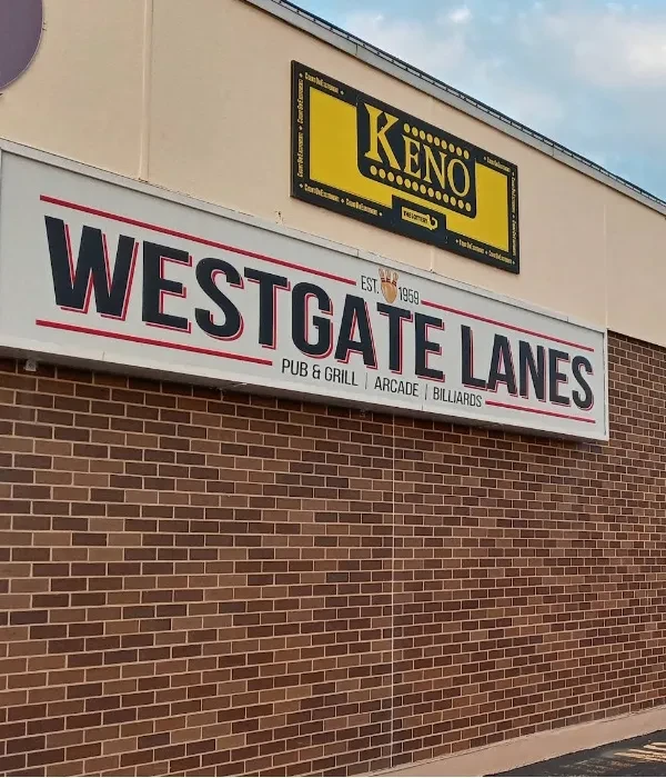 Exterior sign for Westgate Lanes, featuring pub, grill, arcade, billiards.