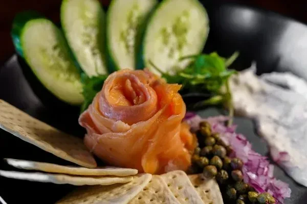 Smoked salmon rose, cucumber, capers, red onion, herbs, crackers.