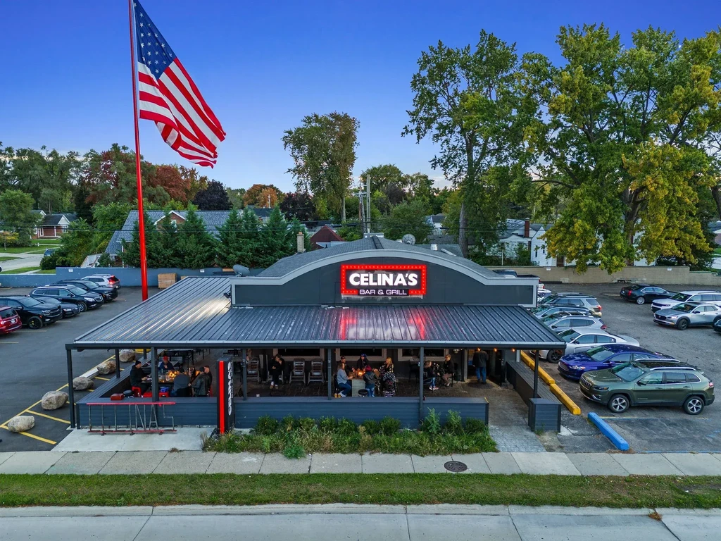 Aerial view of Celina's Bar & Grill with patio and American flag.
