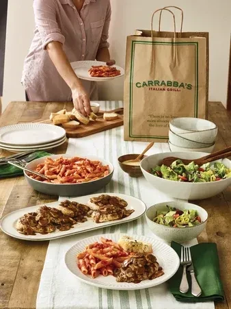 Overhead view of a Carrabba's Italian food spread being served.