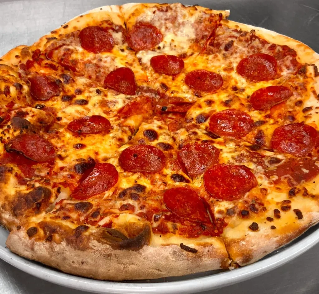 Freshly baked pepperoni pizza with melted cheese, crispy pepperoni, and golden crust.