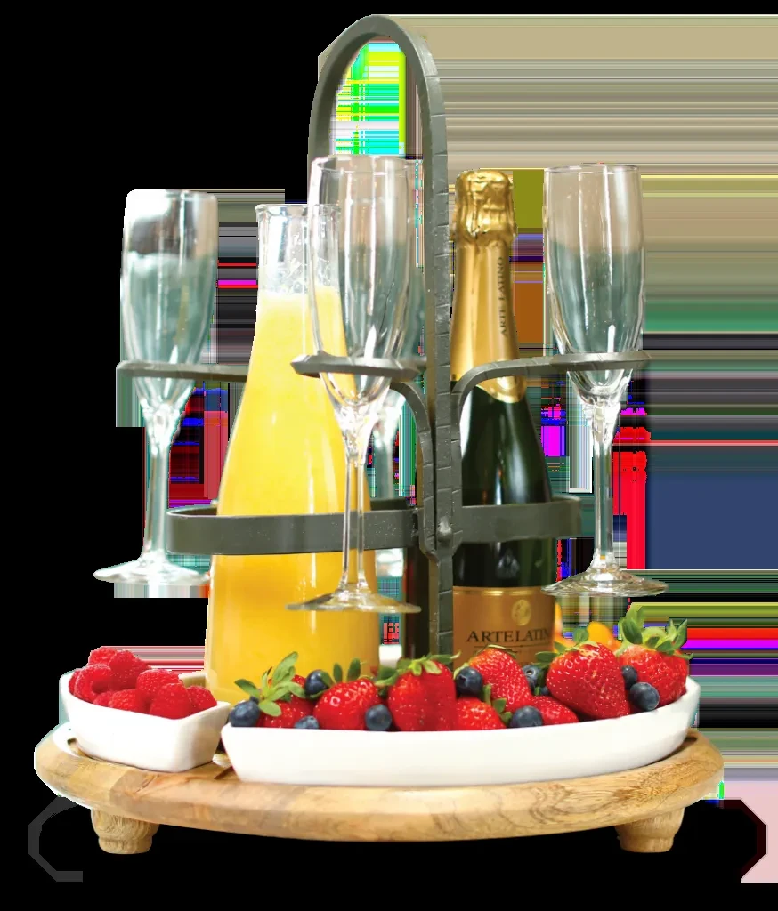 Mimosa caddy with orange juice, sparkling wine, flutes, and fresh berries.