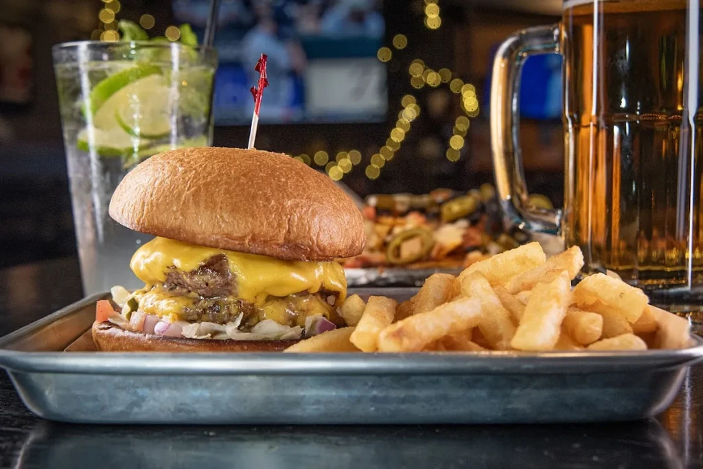 Double cheeseburger, melted cheese, lettuce, red onions, and french fries.