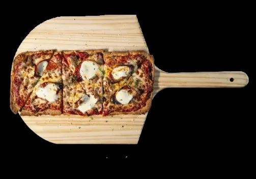 Rectangular pizza with fresh mozzarella, meat, and herbs on a wooden peel.