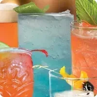 Vibrant collage of colorful alcoholic drinks in various garnished glasses.