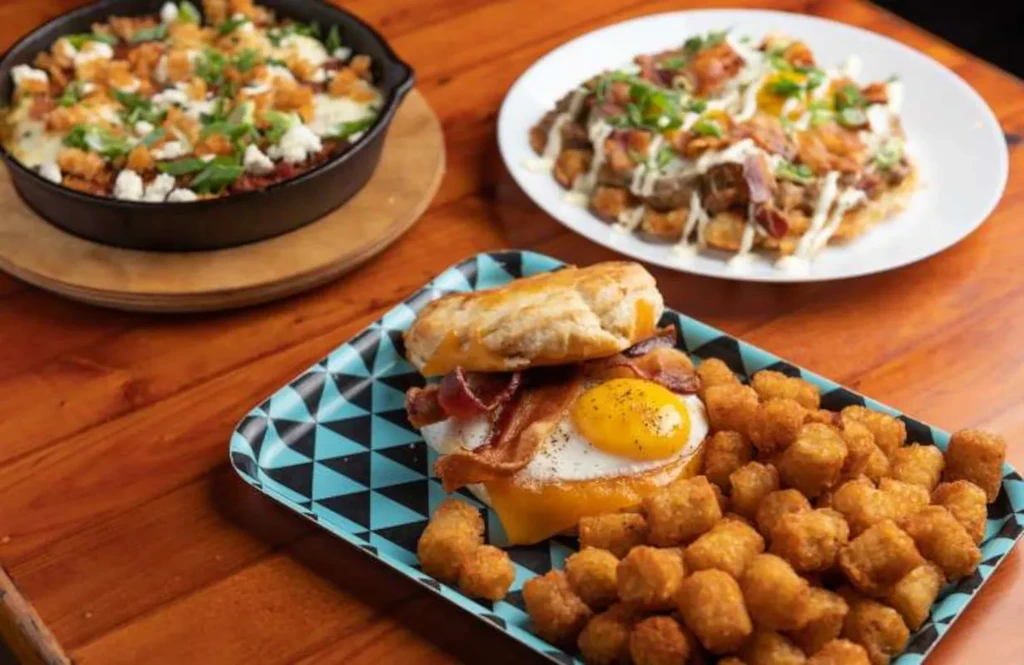 Three hearty breakfast dishes: biscuit sandwich, skillet casserole, and loaded hash.