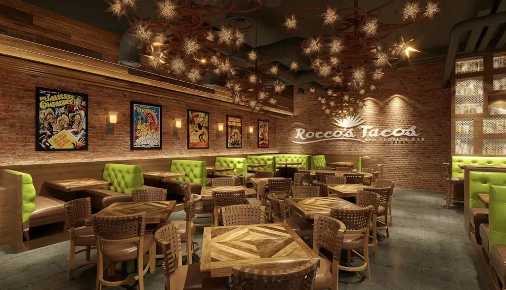 Rocco's Tacos dining area: rustic brick walls, lime-green booths, star ceiling.