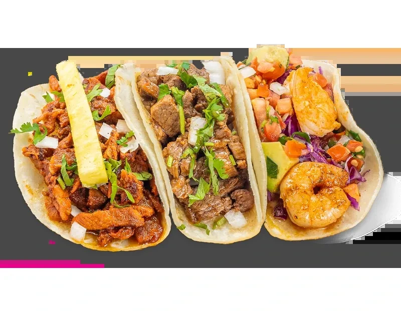 Three distinct tacos: al pastor, steak, and shrimp, arranged horizontally.