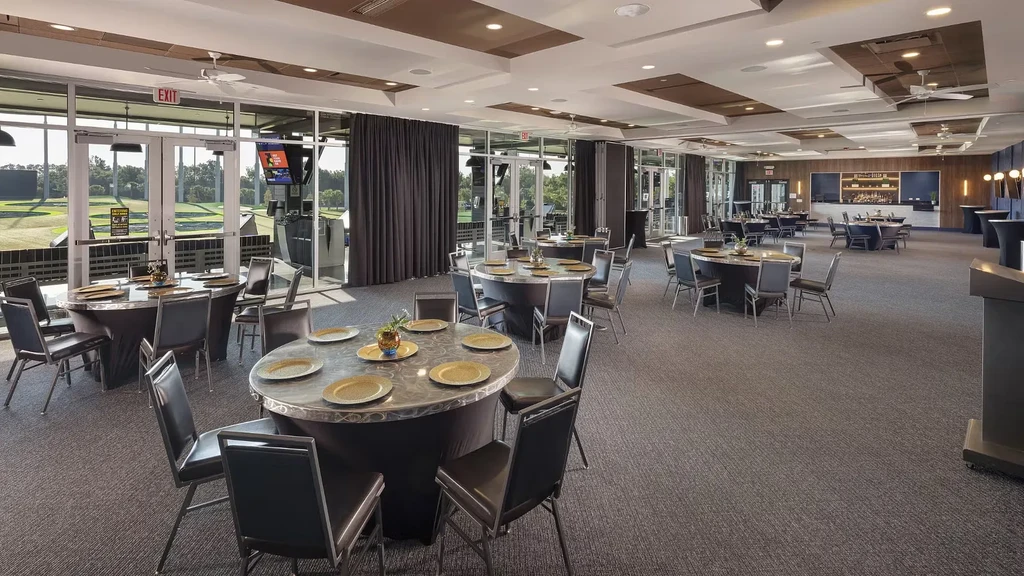 Modern dining and event room overlooking a golf course.