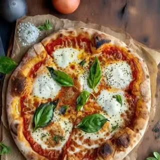 Neapolitan pizza with charred crust, tomato, mozzarella, and basil.
