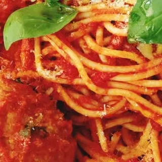 Spaghetti with meatball, chunky red sauce, Parmesan cheese, basil.