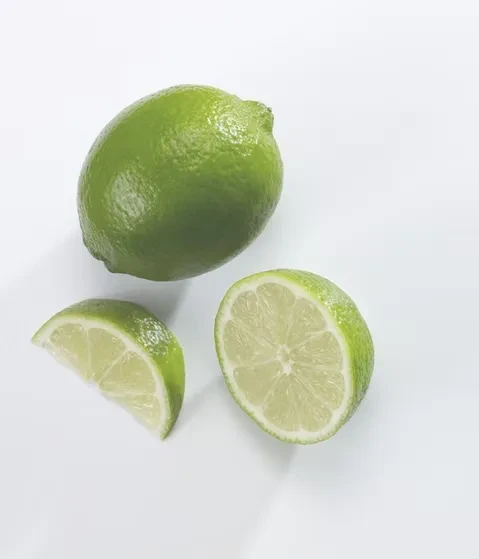 Three green limes: whole, halved, and a wedge on white.