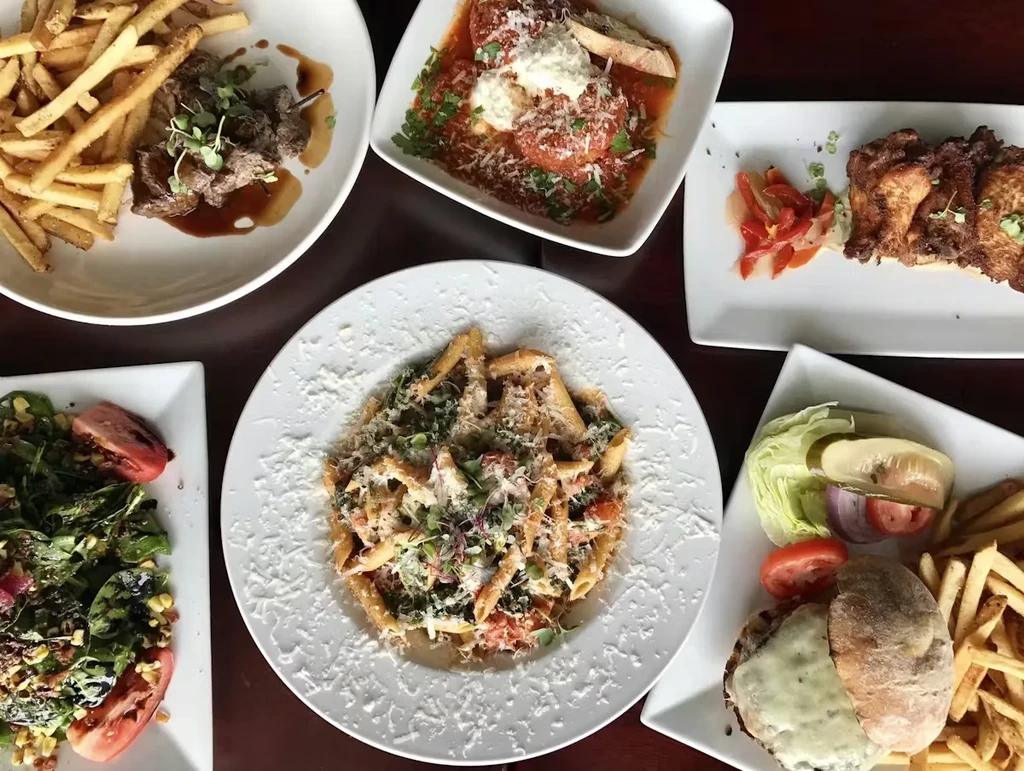 Top-down view of a table laden with diverse meal dishes.