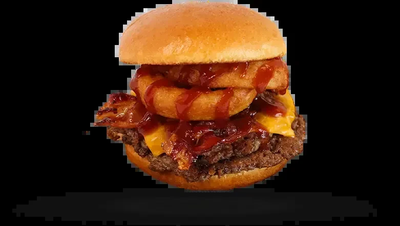 Large burger with patties, cheese, bacon, onion rings, and BBQ sauce.