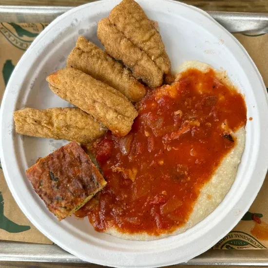 Cracker Barrel meal: fried fish, grits with sauce, and cornbread.