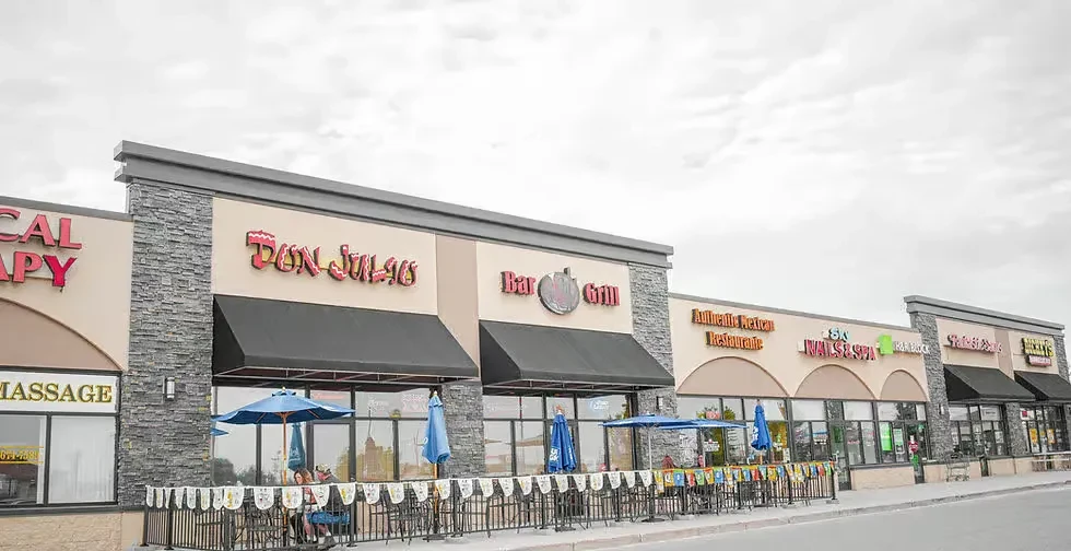 Modern strip mall featuring Don Julio restaurant with outdoor dining.