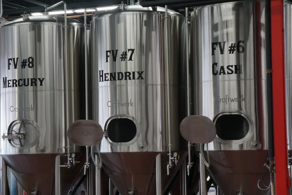 Three stainless steel Craftwerk brewery tanks, named Mercury, Hendrix, Cash.