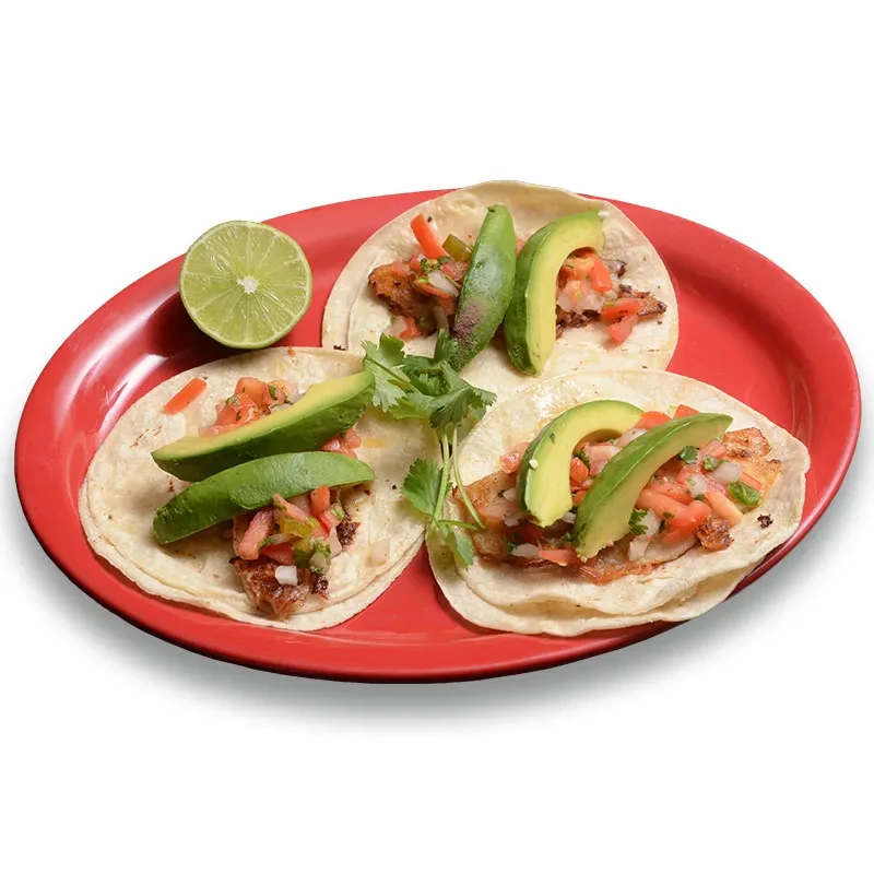 Three soft-shell tacos with grilled fish, pico de gallo, avocado, lime.