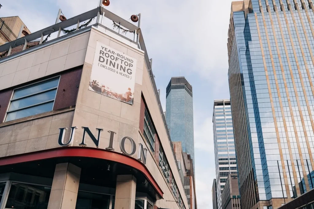 Modern building featuring 'UNION' restaurant and heated rooftop dining.