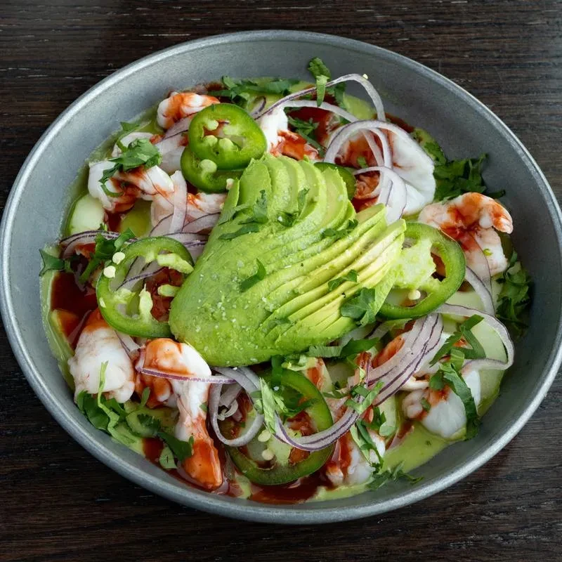 Overhead shot of shrimp ceviche with avocado, onion, and jalapeño.