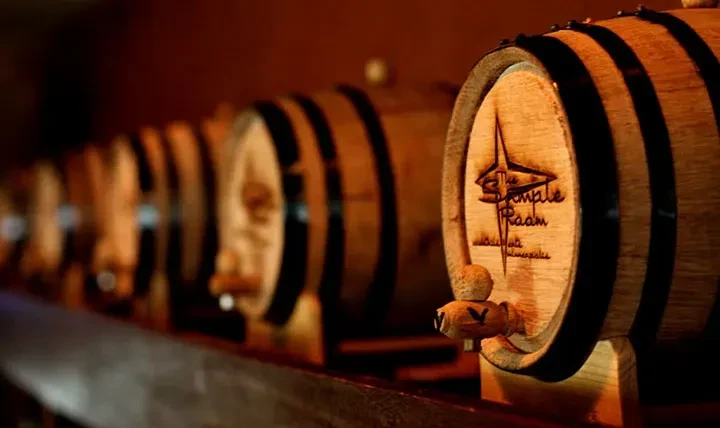 Front wooden barrel branded "The Sample Room Minneapolis" with spigot.