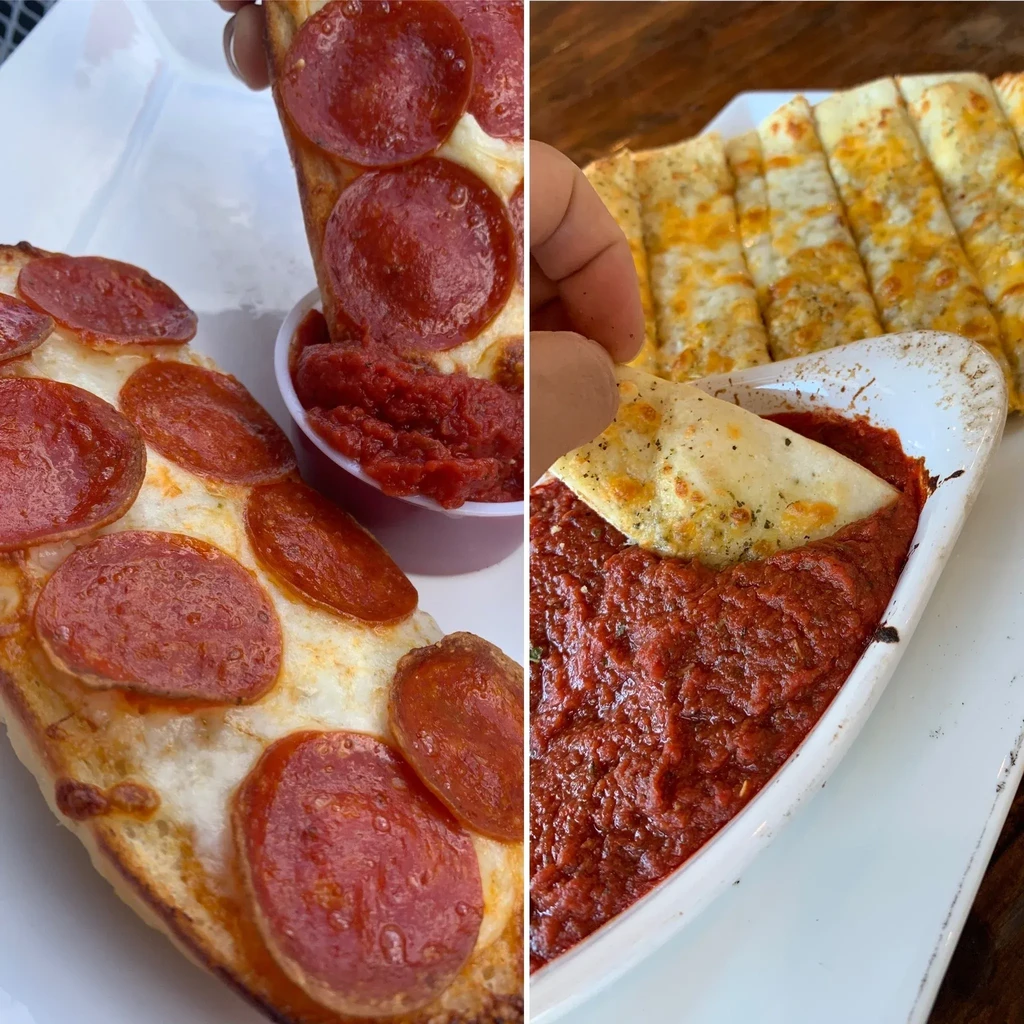 Hands dip pepperoni-covered and herb-speckled cheesy bread into red sauces.