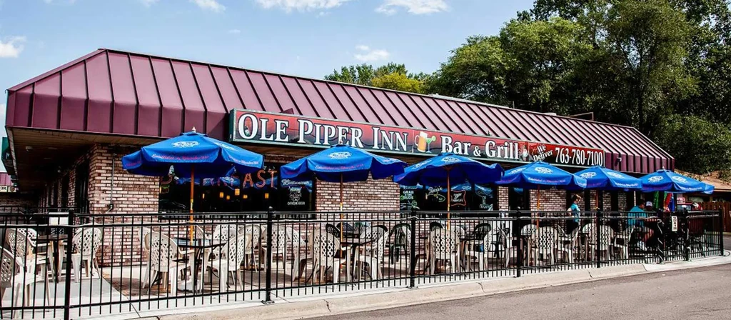 Exterior of OLE PIPER INN Bar & Grill with outdoor patio.