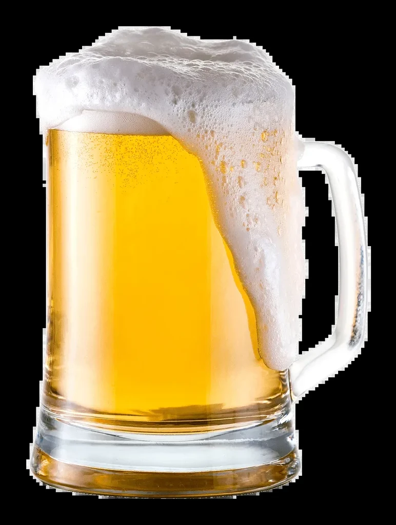 Golden beer in a glass mug with overflowing white foam and condensation.