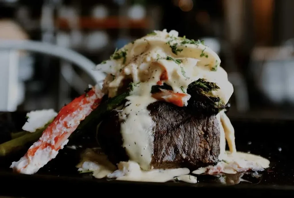 Filet mignon with hollandaise, king crab, and asparagus.