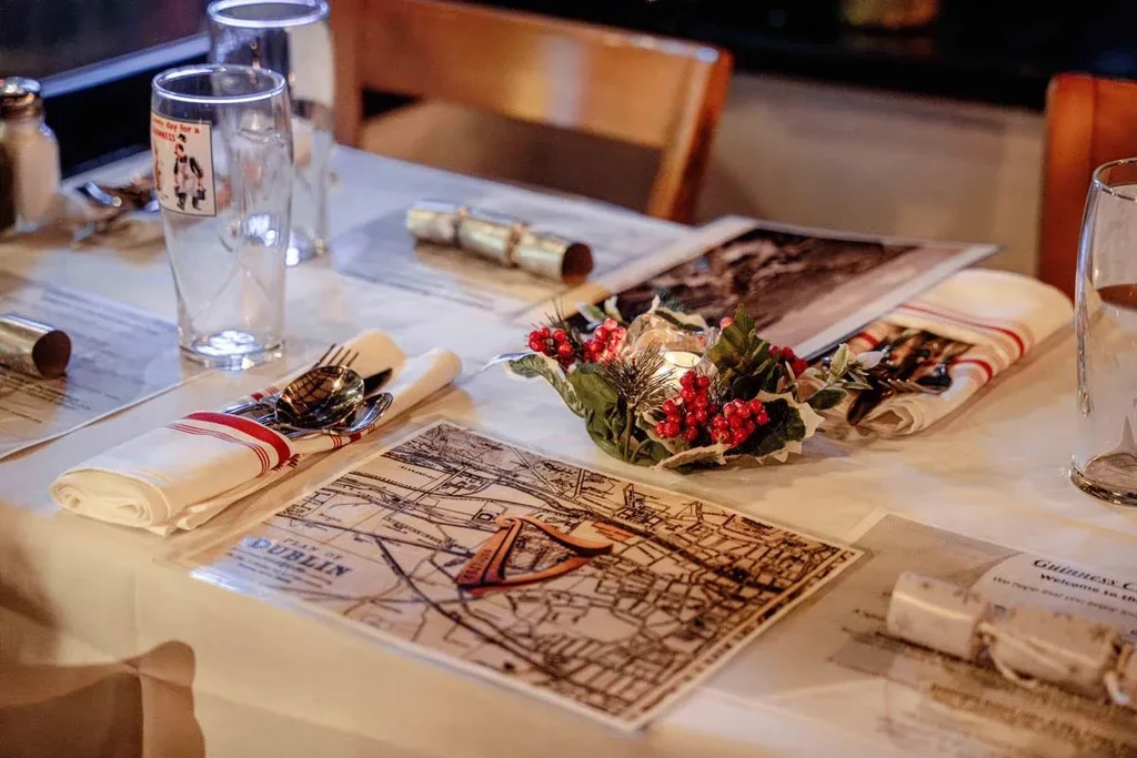 Restaurant table set for holidays with candle centerpiece and map placemat.