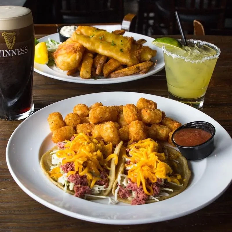 Corned beef tacos, tater tots, fish and chips, Guinness, and green cocktail.