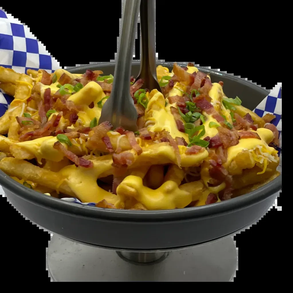 Loaded french fries with melted cheese, bacon bits, and green onions.