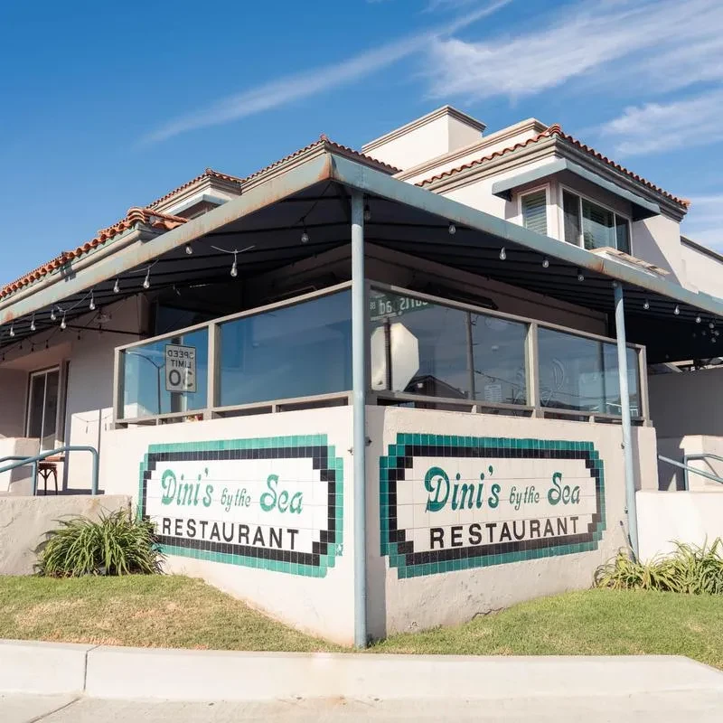 Dini's by the Sea Restaurant exterior, Mediterranean style, outdoor patio.