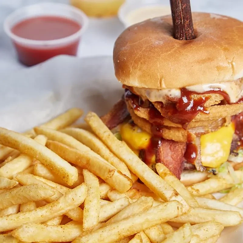 Heavily loaded double patty burger, fries, and three dipping sauces.