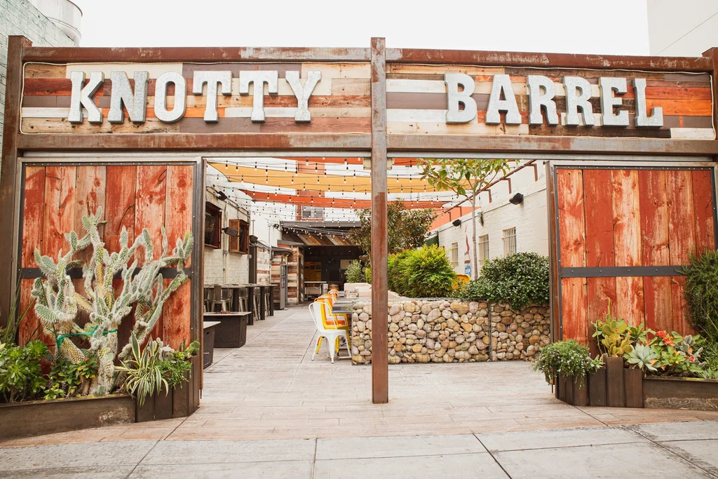 Knotty Barrel's rustic, industrial-chic entrance and outdoor patio.