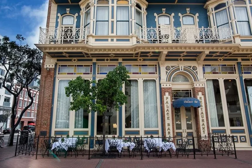 Ornate multi-story Palace Bar & Restaurant with outdoor dining.